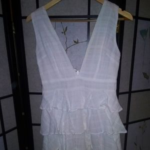 White belted dress with plunging neckline and back, layered skirt above